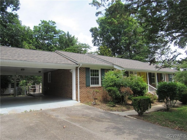 10212 Sauna Dr, North Chesterfield, VA 23236 - single story home featuring driveway, a carport, brick siding, and roof with shingles