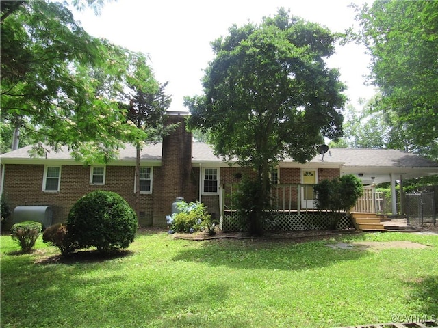 10212 Sauna Dr, North Chesterfield, VA 23236 - rear view of house featuring brick siding, a lawn, and crawl space