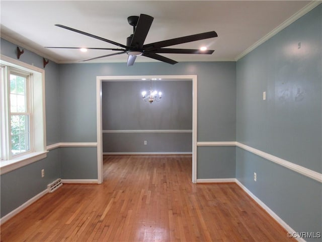 10212 Sauna Dr, North Chesterfield, VA 23236 - spare room with a chandelier, wood-type flooring, a ceiling fan, and crown molding