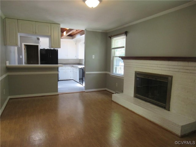 10212 Sauna Dr, North Chesterfield, VA 23236 - kitchen with light wood-type flooring, white cabinets, crown molding, and a fireplace
