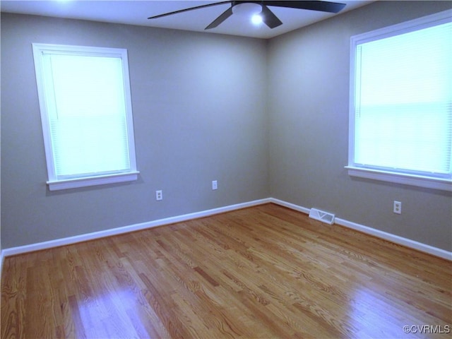 10212 Sauna Dr, North Chesterfield, VA 23236 - unfurnished room featuring a ceiling fan, wood finished floors, and plenty of natural light