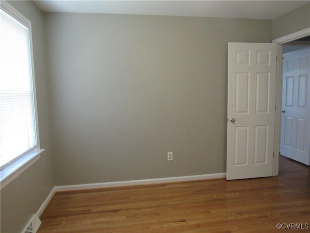 10212 Sauna Dr, North Chesterfield, VA 23236 - empty room with plenty of natural light and light wood-style floors