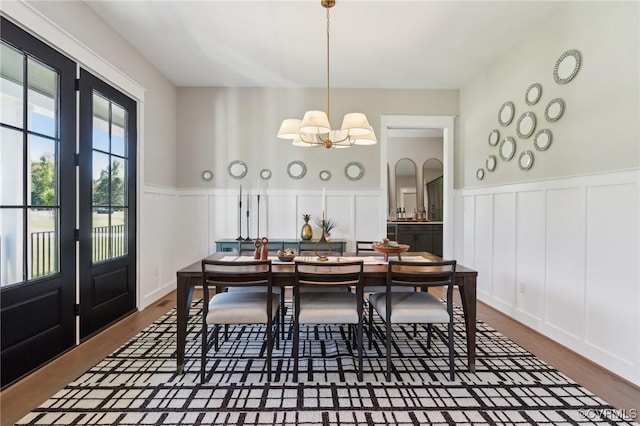 TBD Springfield Rd, Goochland, VA 23063 - dining area featuring a decorative wall, a chandelier, a wainscoted wall, and dark wood-style flooring