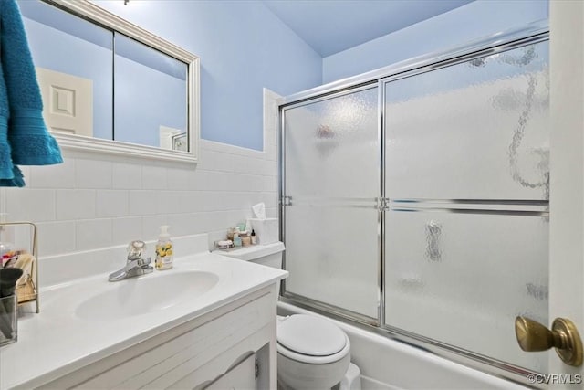 5205 Jerral Dr, Prince George, VA 23875 - bathroom with vanity, enclosed tub / shower combo, tasteful backsplash, and tile walls