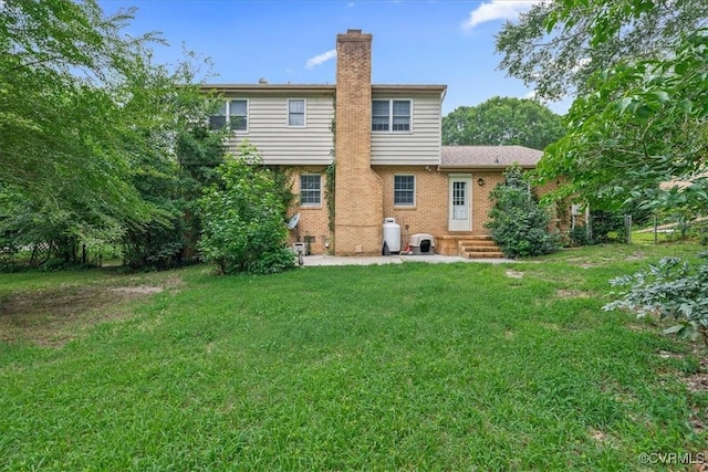 5205 Jerral Dr, Prince George, VA 23875 - rear view of property with a chimney, brick siding, and a lawn