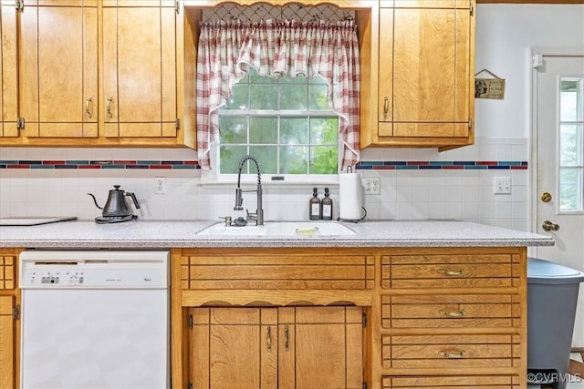 5205 Jerral Dr, Prince George, VA 23875 - kitchen featuring white dishwasher, light countertops, healthy amount of natural light, and decorative backsplash