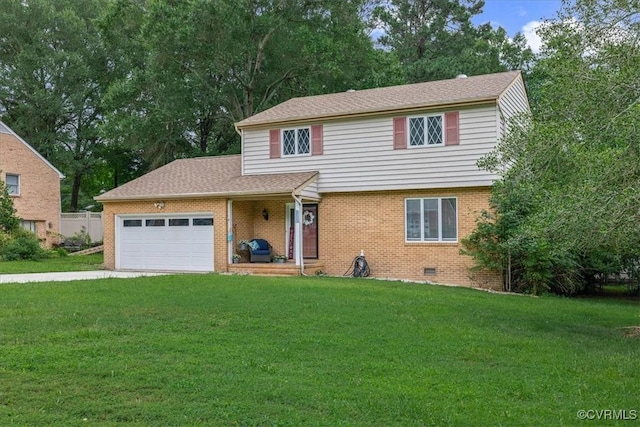 5205 Jerral Dr, Prince George, VA 23875 - view of front of house with an attached garage, a front yard, brick siding, and driveway