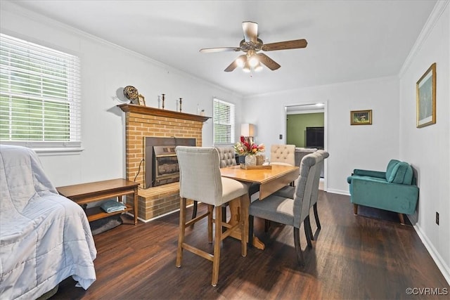 5205 Jerral Dr, Prince George, VA 23875 - dining room with wood finished floors, ceiling fan, ornamental molding, and a brick fireplace