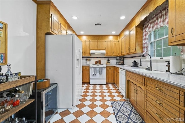 5205 Jerral Dr, Prince George, VA 23875 - kitchen featuring white appliances, under cabinet range hood, light countertops, light floors, and beverage cooler