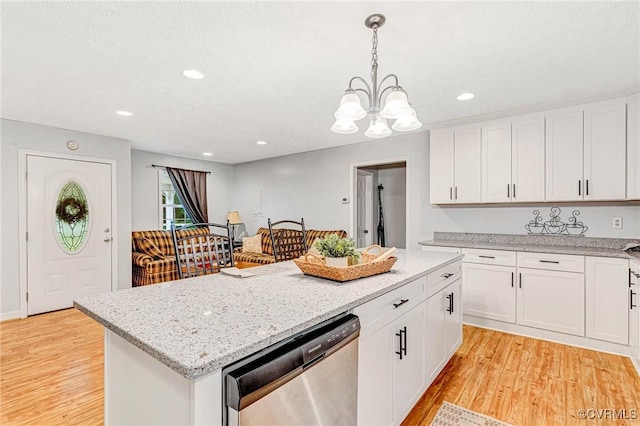 9118 Epps Rd, Mechanicsville, VA 23111 - kitchen featuring stainless steel dishwasher, light wood-style flooring, white cabinetry, light stone countertops, and a chandelier