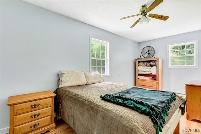 9118 Epps Rd, Mechanicsville, VA 23111 - bedroom featuring light wood-style floors, multiple windows, and a ceiling fan