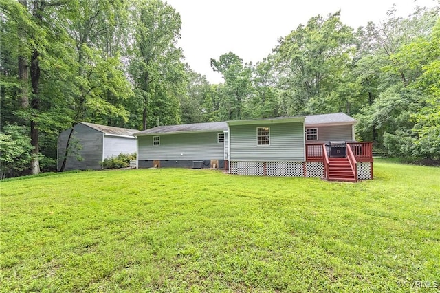 9118 Epps Rd, Mechanicsville, VA 23111 - back of house featuring a deck, a storage shed, and a lawn
