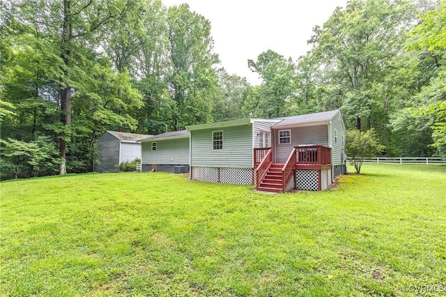 9118 Epps Rd, Mechanicsville, VA 23111 - back of property with a wooden deck, a storage shed, and crawl space