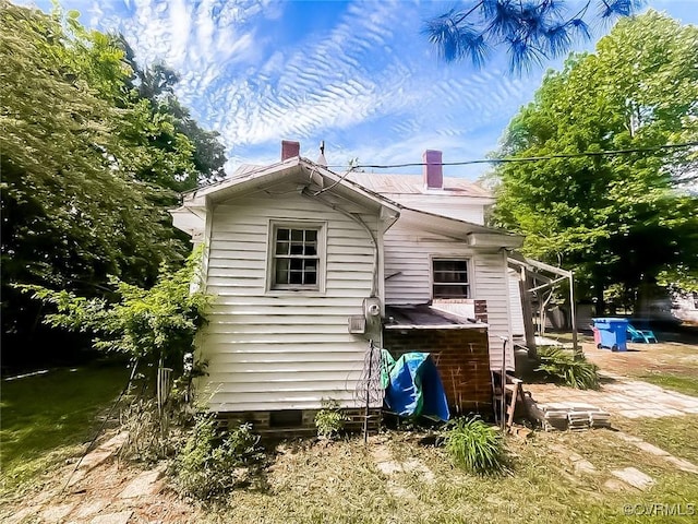 22446 E Depot St, Newsoms, VA 23874 - view of side of property featuring a chimney