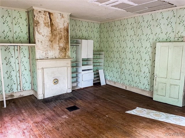 22446 E Depot St, Newsoms, VA 23874 - unfurnished living room featuring wallpapered walls and dark wood-style floors
