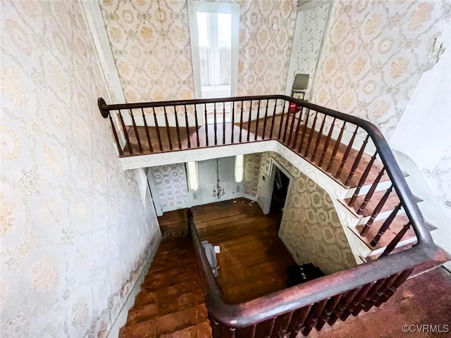 22446 E Depot St, Newsoms, VA 23874 - staircase with wallpapered walls and wood finished floors