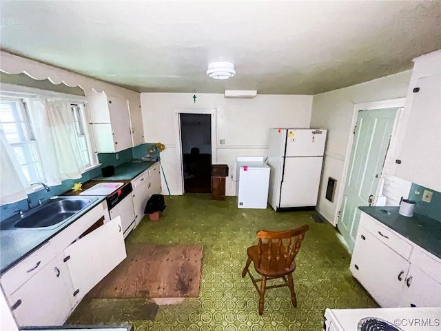 22446 E Depot St, Newsoms, VA 23874 - kitchen featuring freestanding refrigerator, refrigerator, white cabinetry, and dark countertops