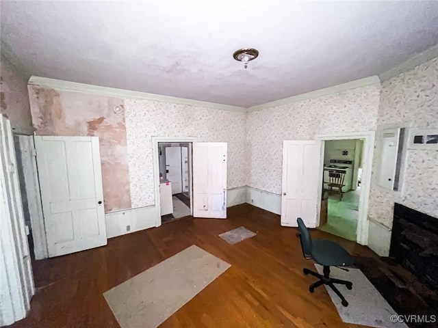 22446 E Depot St, Newsoms, VA 23874 - unfurnished office with wallpapered walls, wood finished floors, and ornamental molding