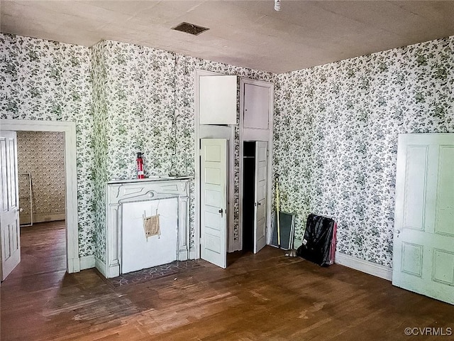 22446 E Depot St, Newsoms, VA 23874 - unfurnished room featuring wallpapered walls and wood finished floors