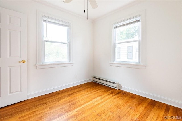 2711 Maplewood Rd, Henrico, VA 23228 - empty room with a baseboard heating unit, ceiling fan, light wood-style flooring, and crown molding