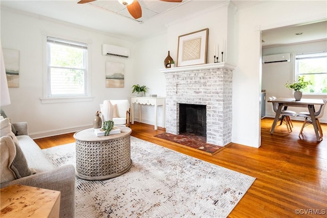 2711 Maplewood Rd, Henrico, VA 23228 - living area with an AC wall unit, a ceiling fan, healthy amount of natural light, and ornamental molding