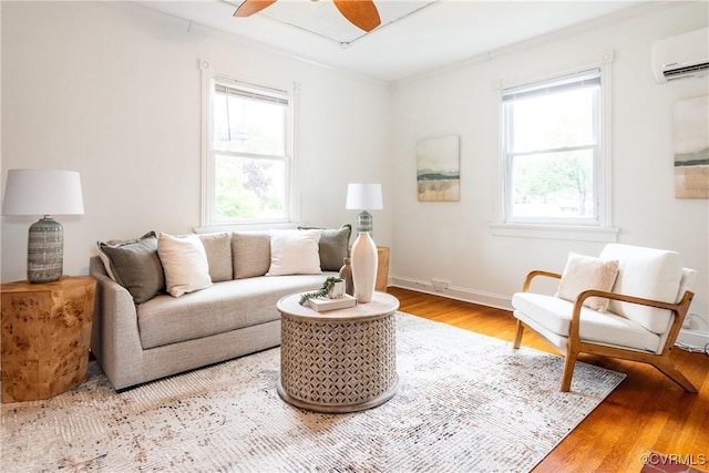 2711 Maplewood Rd, Henrico, VA 23228 - living room with a wall mounted AC, wood finished floors, and ceiling fan