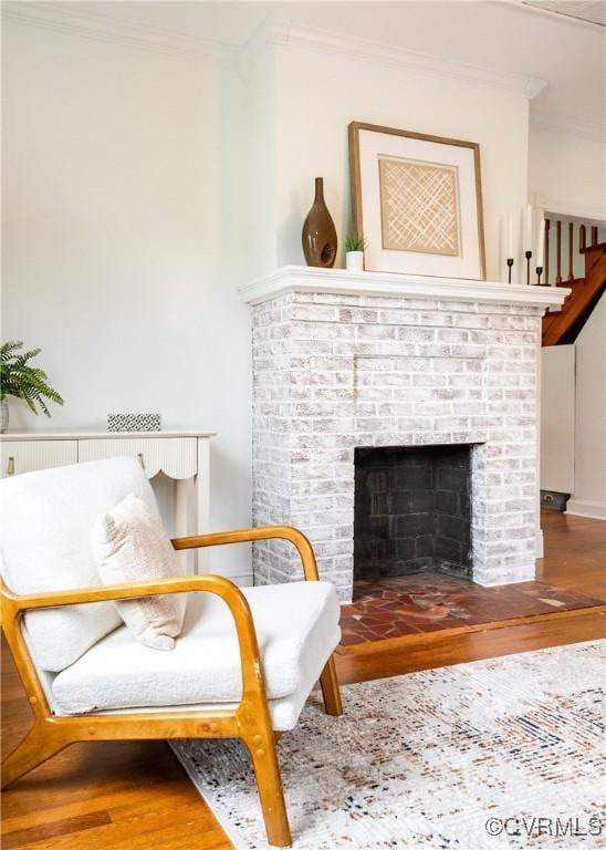 2711 Maplewood Rd, Henrico, VA 23228 - living area featuring ornamental molding, wood finished floors, and a brick fireplace