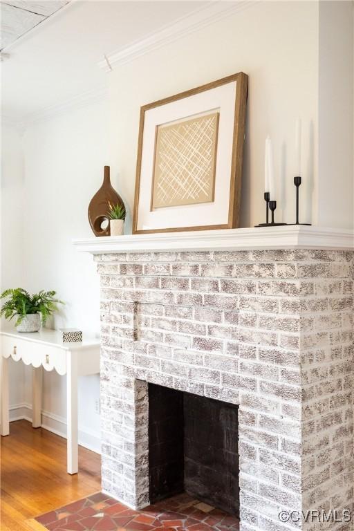 2711 Maplewood Rd, Henrico, VA 23228 - detailed view of ornamental molding, a brick fireplace, and wood finished floors