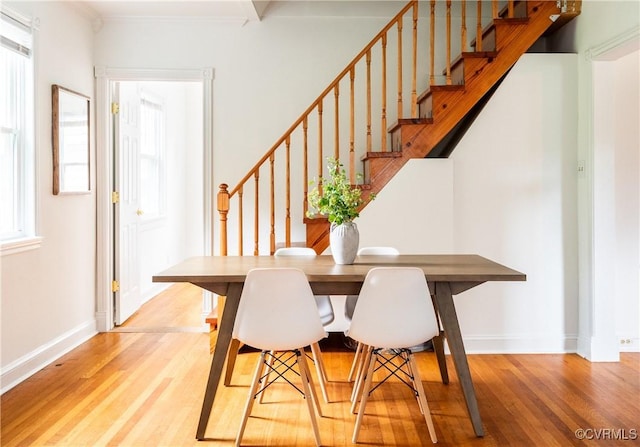 2711 Maplewood Rd, Henrico, VA 23228 - dining room with wood finished floors, stairs, and ornamental molding