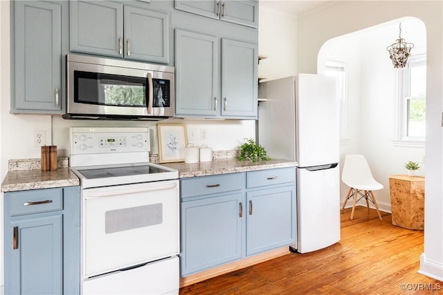 2711 Maplewood Rd, Henrico, VA 23228 - kitchen with white appliances, light wood-style flooring, blue cabinets, and gray cabinetry