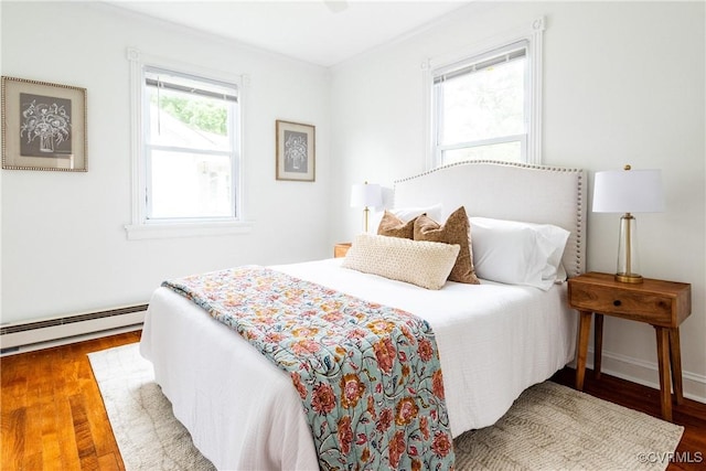 2711 Maplewood Rd, Henrico, VA 23228 - bedroom featuring a baseboard heating unit and wood finished floors