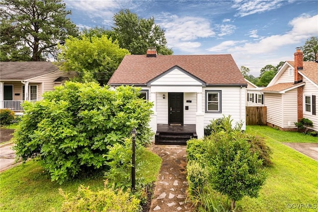 2711 Maplewood Rd, Henrico, VA 23228 - bungalow-style house featuring roof with shingles, a chimney, and a front lawn