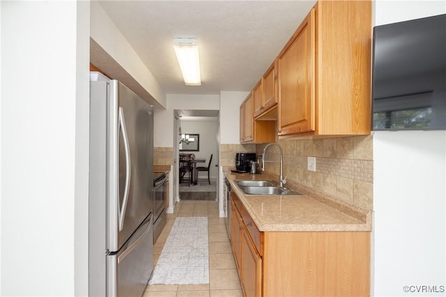 1501 Largo Rd Unit 302, Henrico, VA 23238 - kitchen with appliances with stainless steel finishes, light countertops, decorative backsplash, and light tile patterned floors