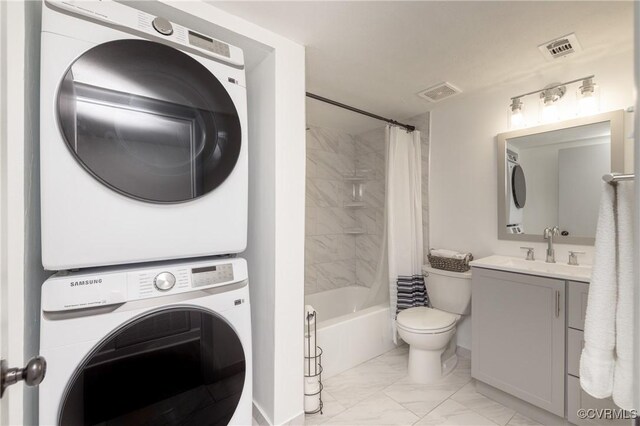 1501 Largo Rd Unit 302, Henrico, VA 23238 - bathroom with estacked washer and dryer, marble look tile flooring, vanity, and shower / bathtub combination with curtain
