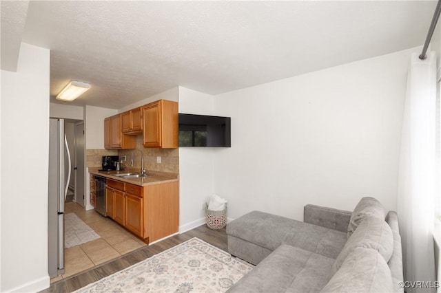 1501 Largo Rd Unit 302, Henrico, VA 23238 - living room featuring light wood finished floors and a textured ceiling