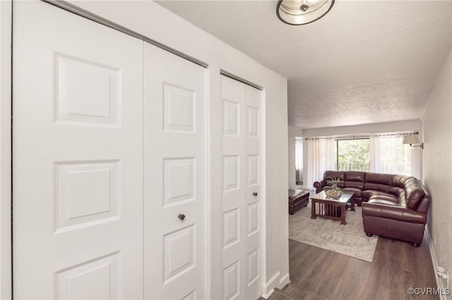 1501 Largo Rd Unit 302, Henrico, VA 23238 - living room featuring a textured ceiling and dark wood finished floors
