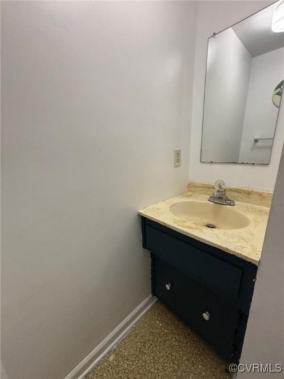 bathroom featuring vanity and baseboards