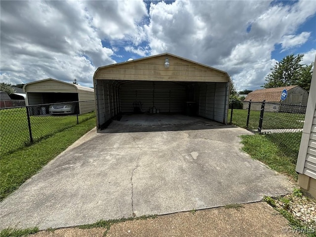 garage featuring a carport and driveway
