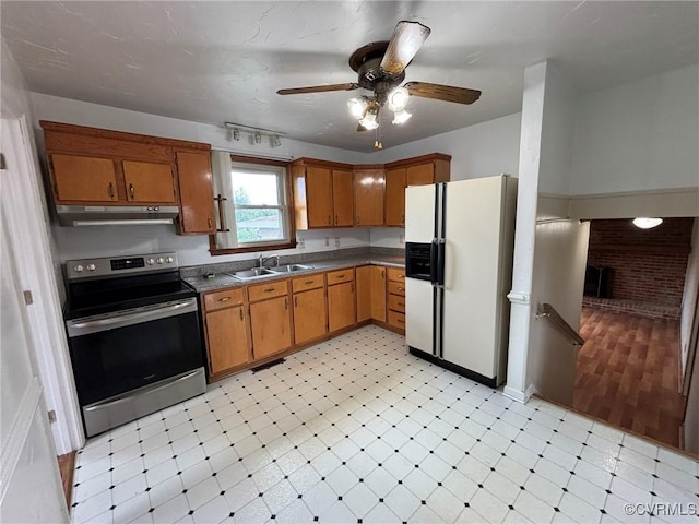 kitchen with stainless steel electric range oven, white fridge with ice dispenser, under cabinet range hood, light flooring, and ceiling fan