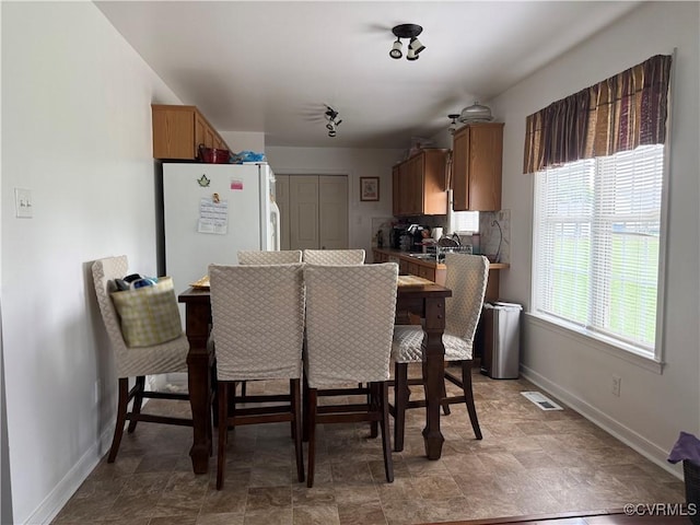 21338 Deodora Ct, Petersburg, VA 23803 - dining room featuring baseboards and stone finish flooring