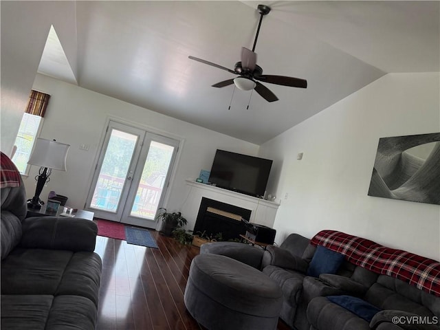 21338 Deodora Ct, Petersburg, VA 23803 - living area with vaulted ceiling, french doors, dark wood-style flooring, a ceiling fan, and a fireplace