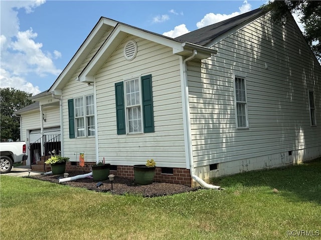21338 Deodora Ct, Petersburg, VA 23803 - view of side of property featuring crawl space, an attached garage, and a lawn