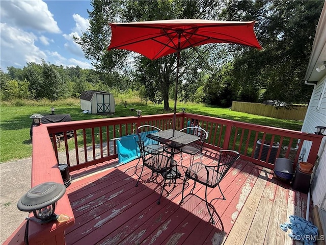21338 Deodora Ct, Petersburg, VA 23803 - deck with a storage unit, outdoor dining space, and a lawn