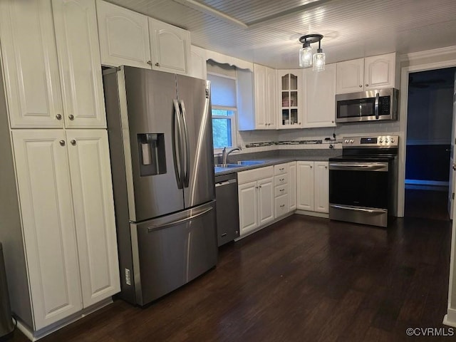 10818 Sebring Dr, Henrico, VA 23233 - kitchen featuring appliances with stainless steel finishes, dark wood finished floors, dark countertops, and white cabinets