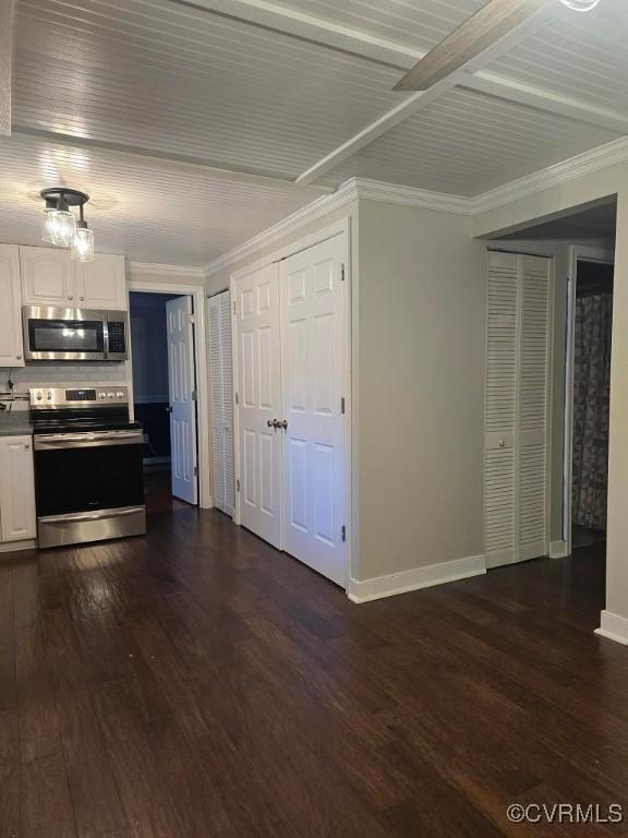 10818 Sebring Dr, Henrico, VA 23233 - kitchen featuring appliances with stainless steel finishes, white cabinetry, dark wood-type flooring, and ornamental molding