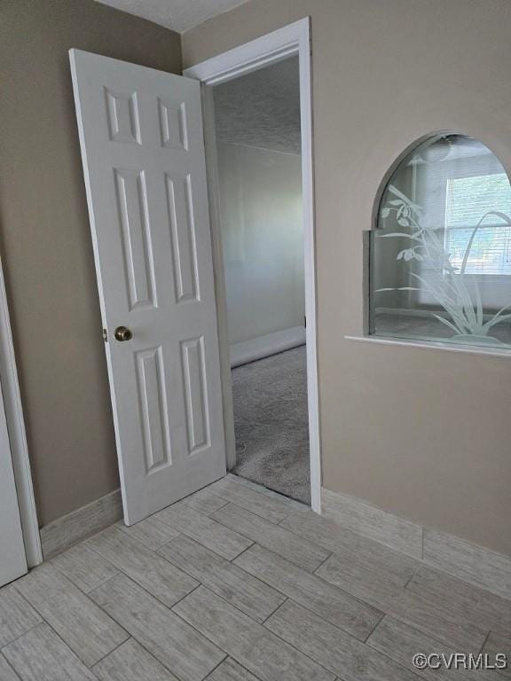 10818 Sebring Dr, Henrico, VA 23233 - unfurnished bedroom with wood tiled floors and a closet