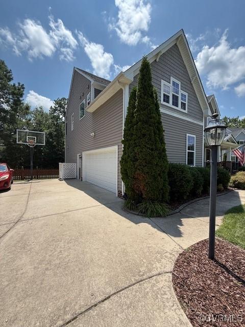 17037 Windon Ct, Moseley, VA 23120 - view of side of property with an attached garage and driveway