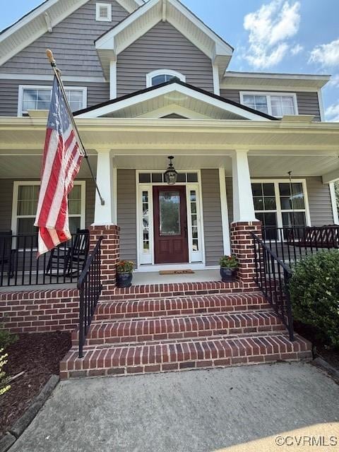 17037 Windon Ct, Moseley, VA 23120 - view of exterior entry with covered porch and brick siding