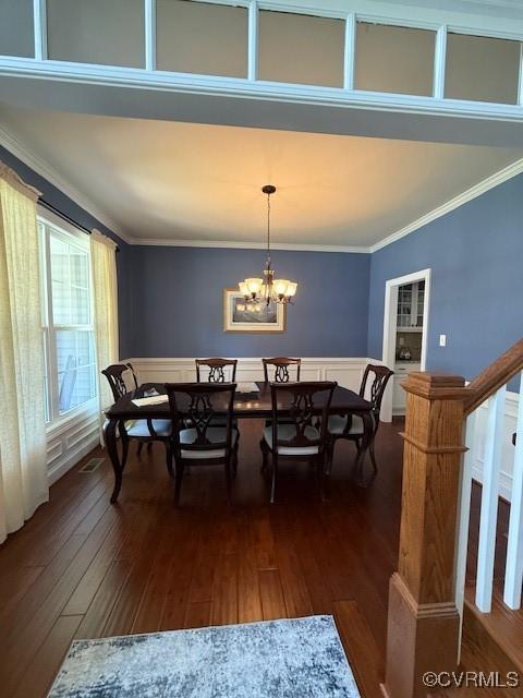 17037 Windon Ct, Moseley, VA 23120 - dining space featuring crown molding, dark wood finished floors, and a chandelier