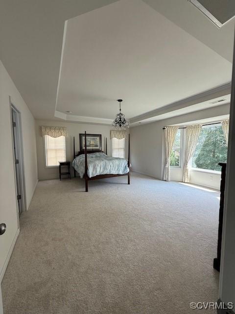 17037 Windon Ct, Moseley, VA 23120 - bedroom featuring light colored carpet, multiple windows, and a chandelier